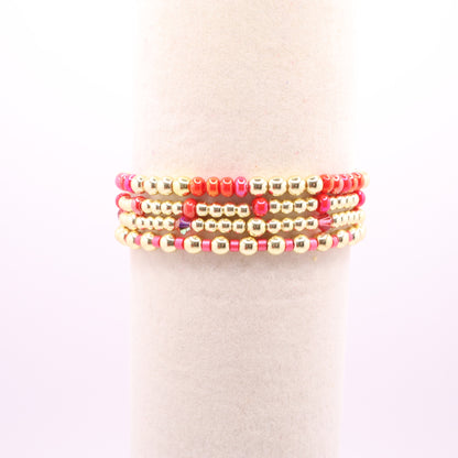 Handmade pink and gold bracelet stack designed for layering and everyday wear.