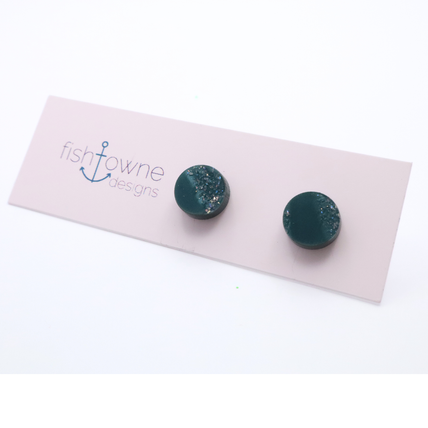 Teal stud earrings on an earring card with Fish Towne Designs branding.