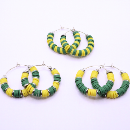 Set of three green and yellow heishi bead hoop earring styles arranged on a white background, showcasing size and pattern variations