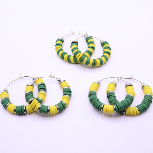 Set of three green and yellow heishi bead hoop earring styles arranged on a white background, showcasing size and pattern variations