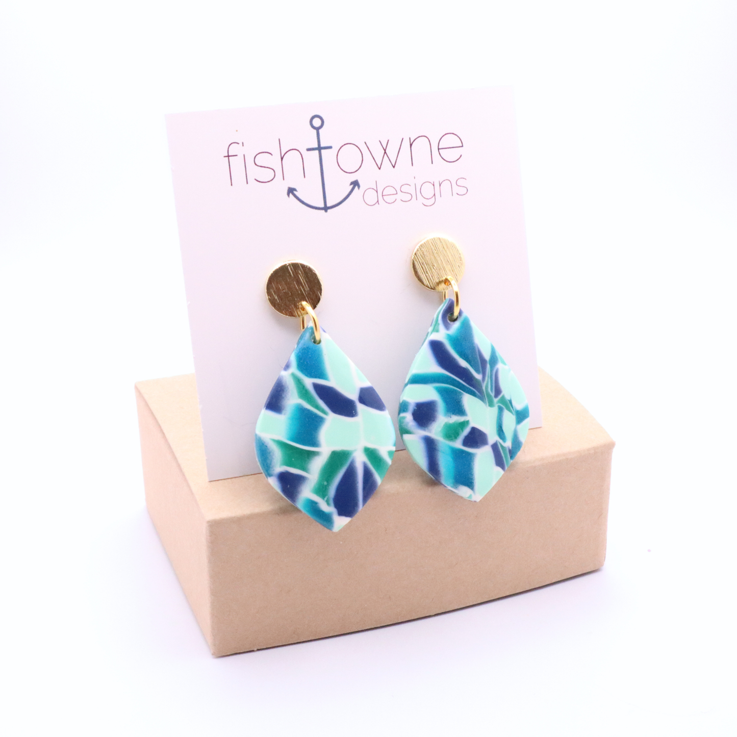 Teal, mint, and navy mosaic teardrop earrings with 18k gold plated studs displayed on a Fish Towne Designs card on a neutral box