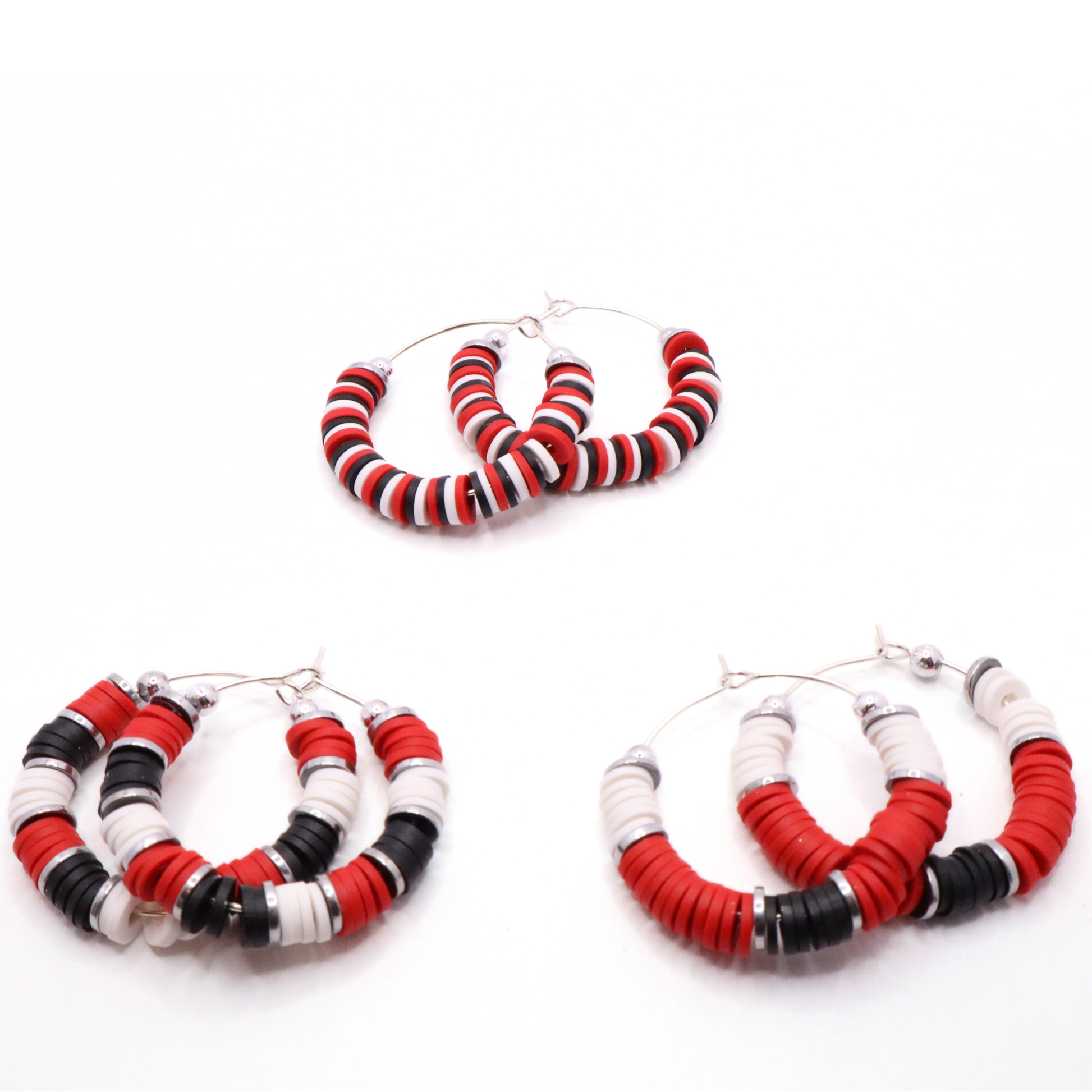 Set of three red, white, and black heishi bead hoop earring styles arranged on a white background, showcasing size and pattern variations