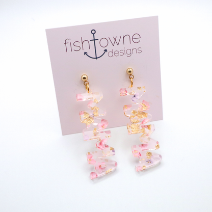 Pink and gold floral mama earrings on a Fish Towne Designs display card against a white background