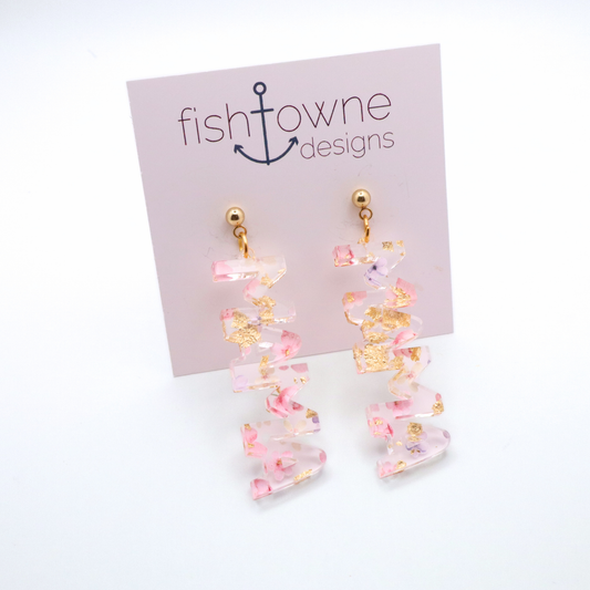Pink and gold floral mama earrings on a Fish Towne Designs display card against a white background
