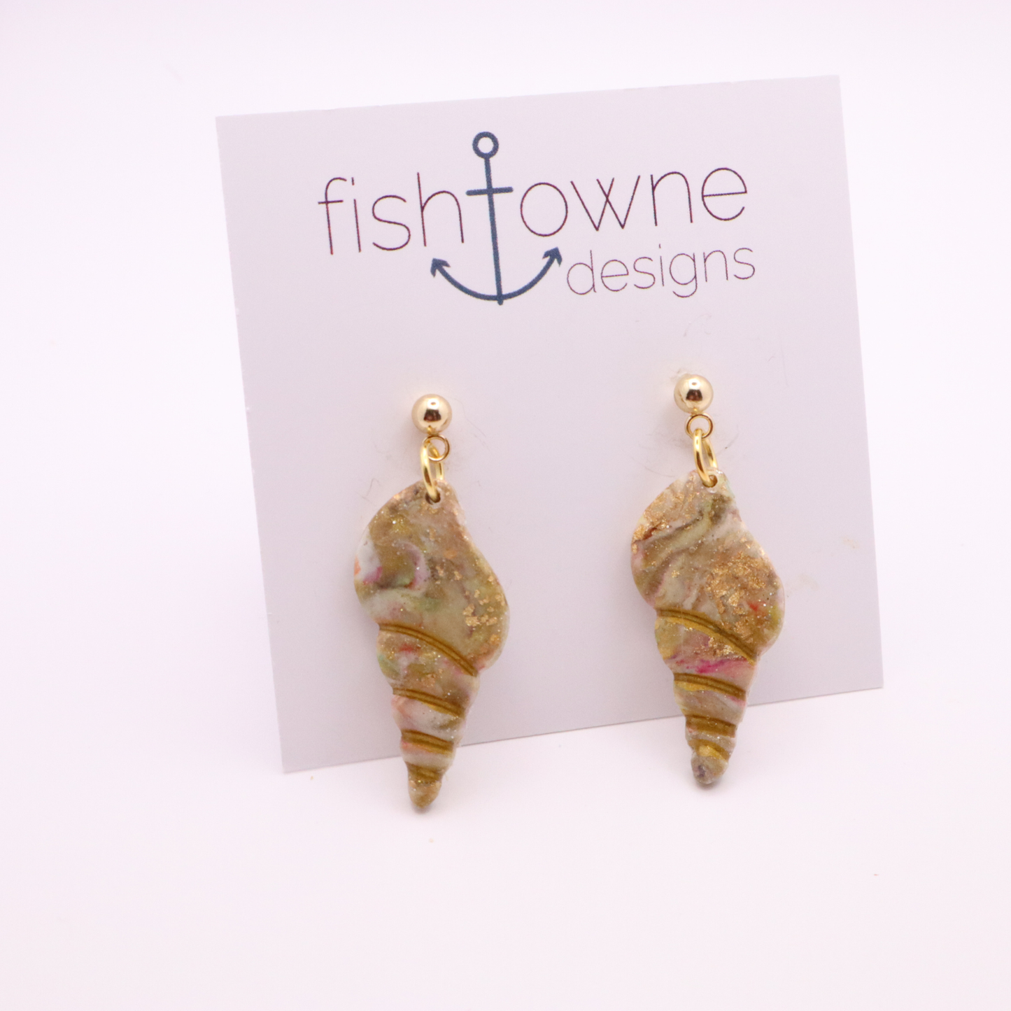 Coastal-inspired seashell dangle earrings in marbled neutral tones with gold accents