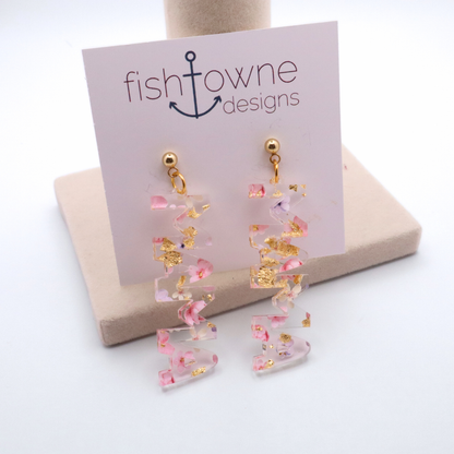 Pair of Pink and Gold earrings on a Fish Towne Designs card with a white background