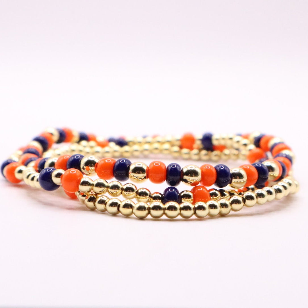 Set of beaded bracelets on a white surface