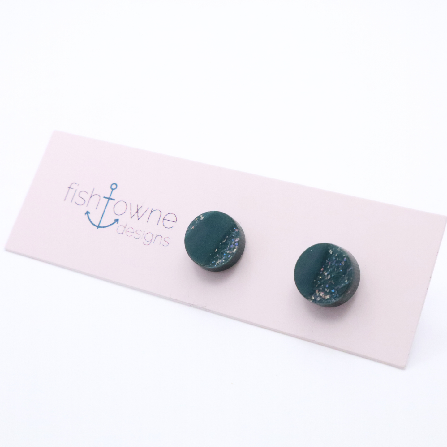 Teal earrings on a Fish Towne Designs card against a white background