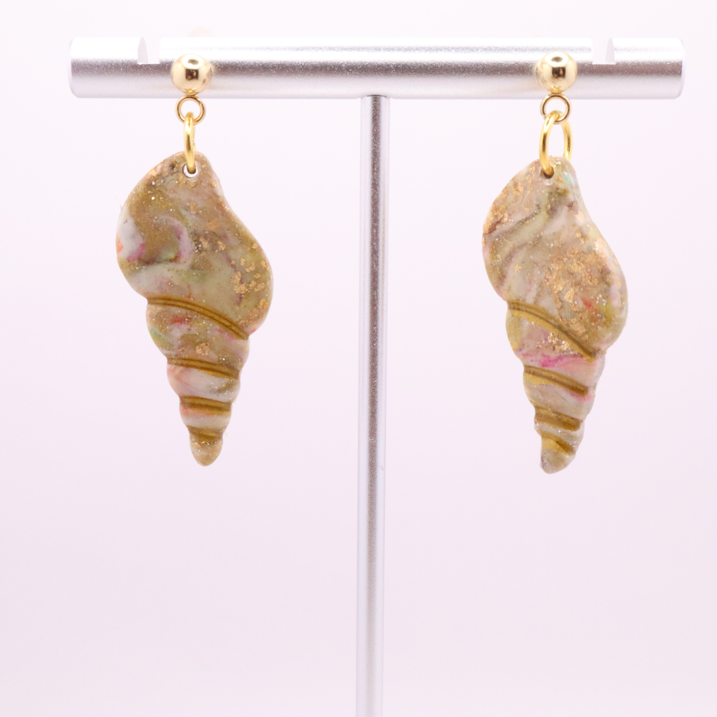 Lightweight polymer clay seashell earrings with soft blush, ivory, and gold shimmer