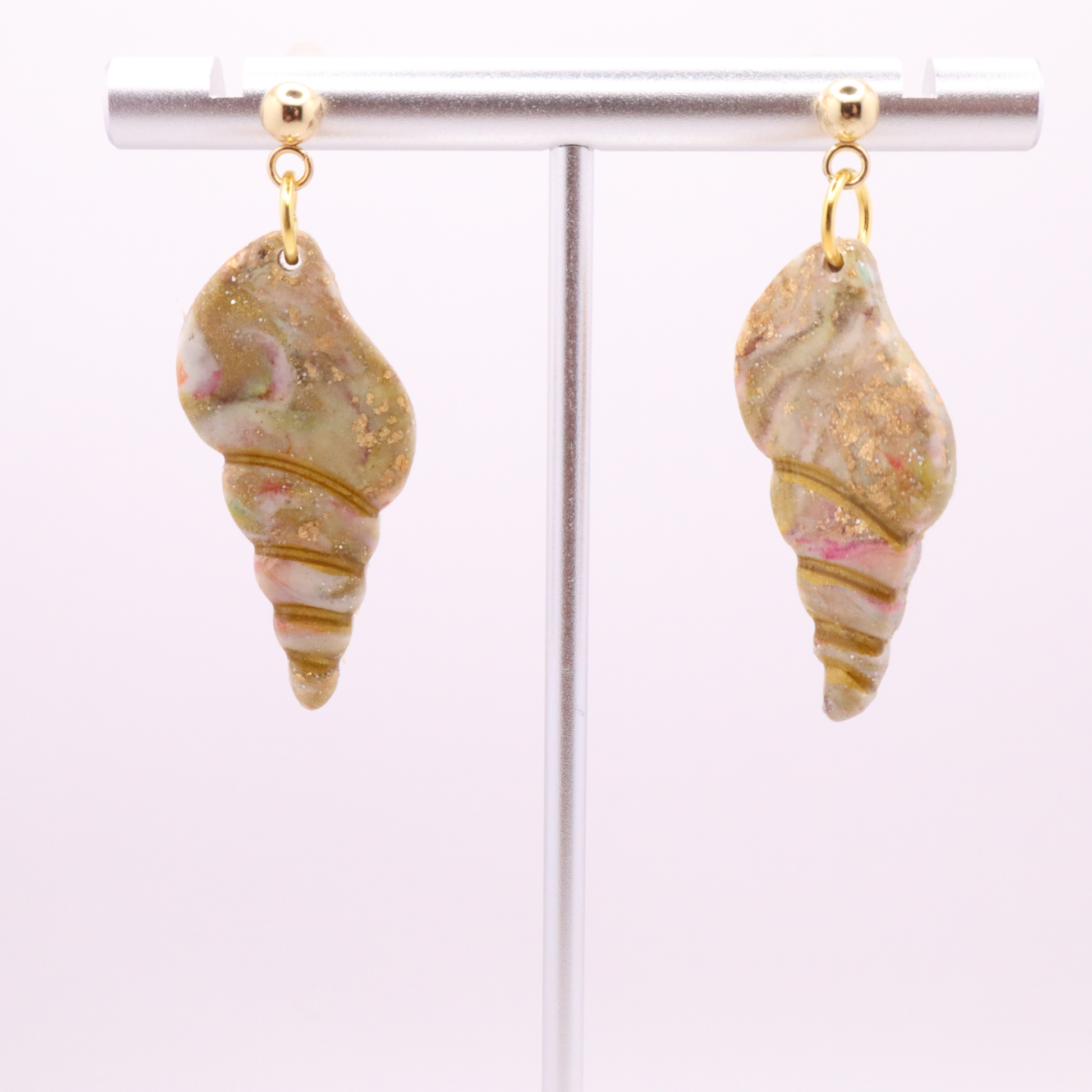Lightweight polymer clay seashell earrings with soft blush, ivory, and gold shimmer