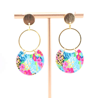 Lightweight acrylic dangle earrings featuring bold blue, pink, and yellow floral print with gold hoop and 18k gold plated stud posts