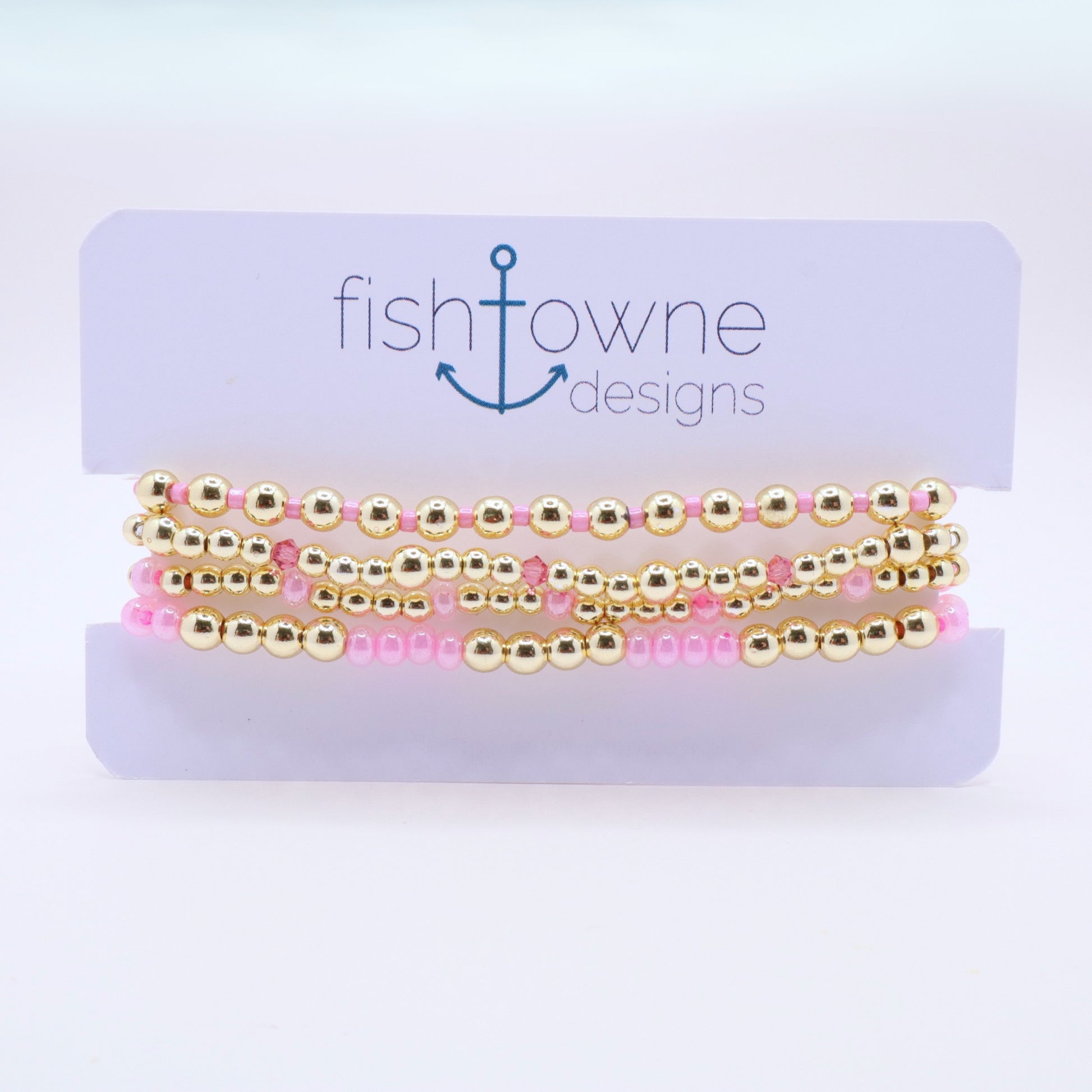 Handmade beaded bracelet set with pink glass beads and sparkling crystal details.