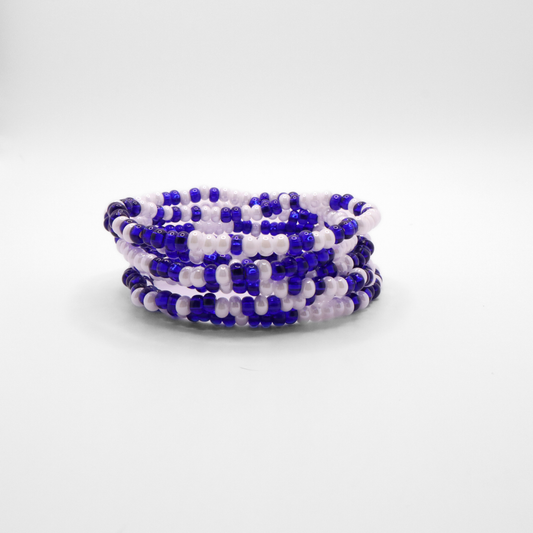 Set of six blue and white seed bead stretch bracelets featuring random blue and white seed beads on a white background