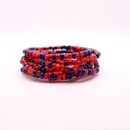 Set of six navy blue and red seed bead stretch bracelets featuring random navy blue and red seed beads on a white background