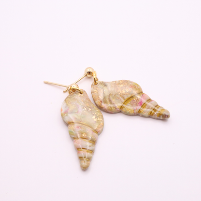 Side view of seashell dangle earrings with gold stud posts and dangling shell design