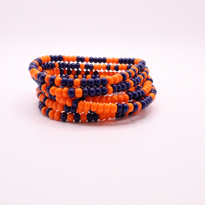 Set of six orange and navy blue seed bead stretch bracelets featuring random orange and navy blue seed beads on a white background