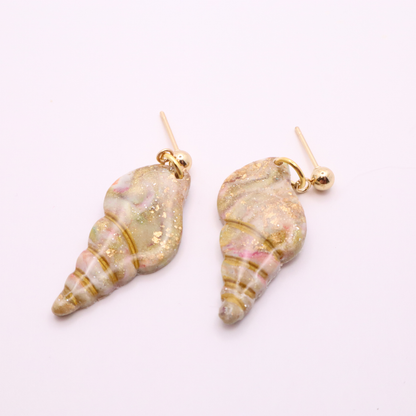 Pair of handmade seashell earrings with gold studs and soft coastal color palette