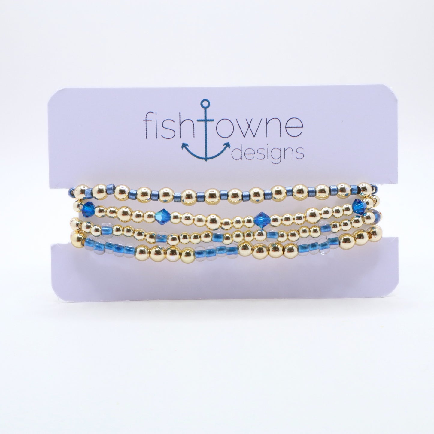 Gold and periwinkle bracelet stack designed for layering and everyday wear.