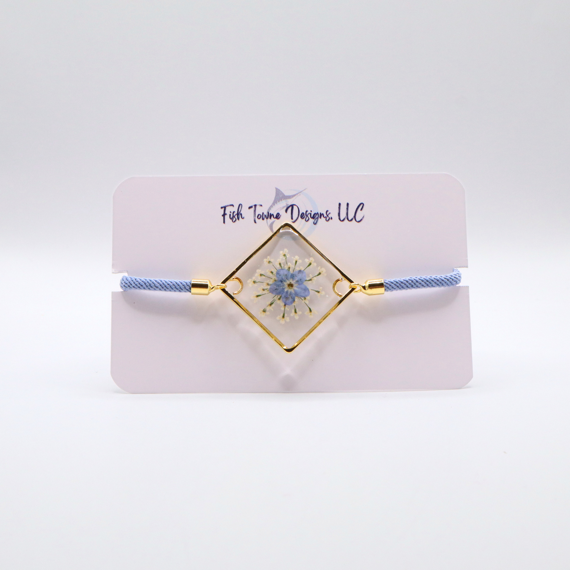 Blue forget-me-not flower resin bracelet with gold frame and light blue adjustable cord dainty handmade jewelry