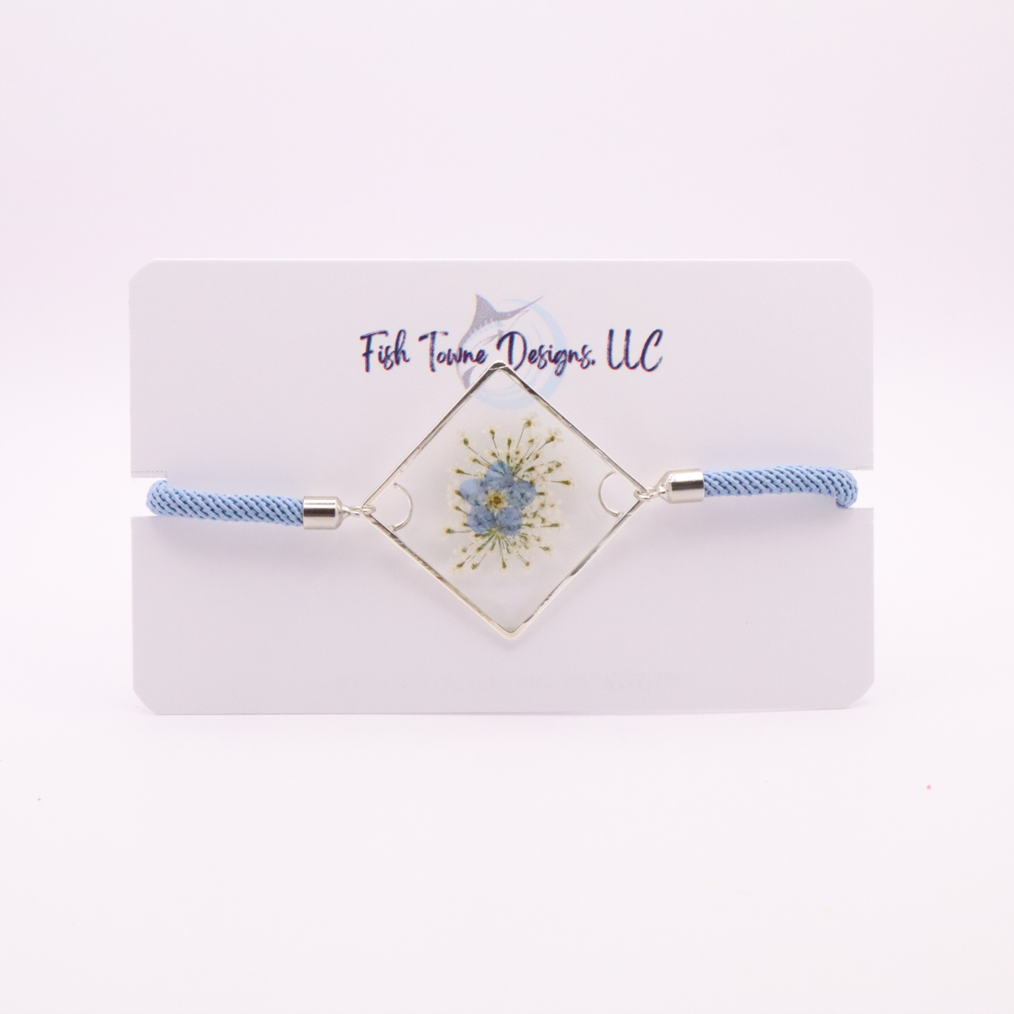 Blue forget-me-not flower resin bracelet with silver frame and light blue adjustable cord handmade botanical jewelry
