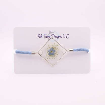 Blue forget-me-not flower resin bracelet with silver frame and light blue adjustable cord handmade botanical jewelry
