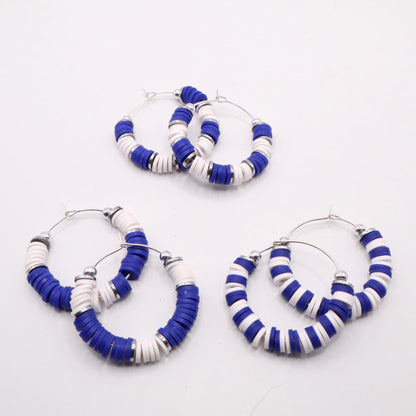 Set of three royal blue and white heishi bead hoop earring styles arranged on a white background, showcasing size and pattern variations