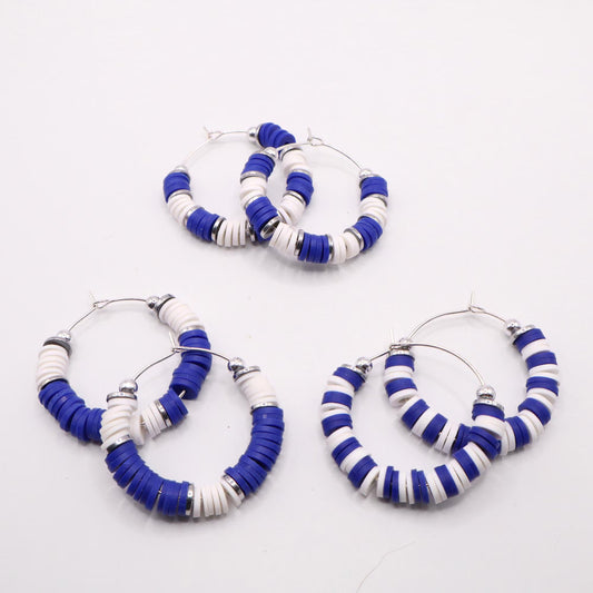 Set of three royal blue and white heishi bead hoop earring styles arranged on a white background, showcasing size and pattern variations