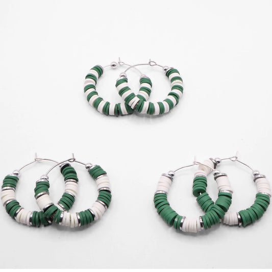 Set of three green and white heishi bead hoop earring styles arranged on a white background, showcasing size and pattern variations