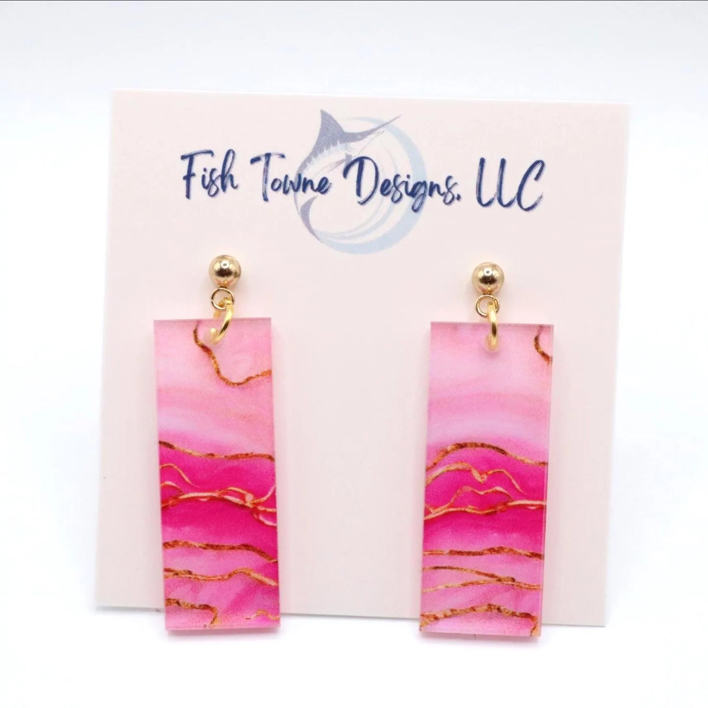 Pink and gold marbled earrings on Fish Towne Designs, LLC branded card.