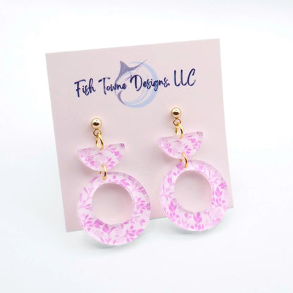 Pink floral earrings on a Fish Towne Designs card against a white background