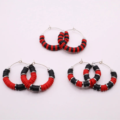 Set of three red and black heishi bead hoop earring styles arranged on a white background, showcasing size and pattern variations