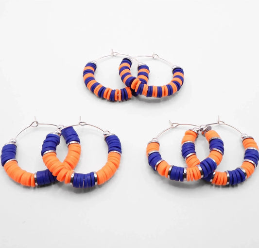 Set of three blue and orange heishi bead hoop earring styles arranged on a white background, showcasing size and pattern variations