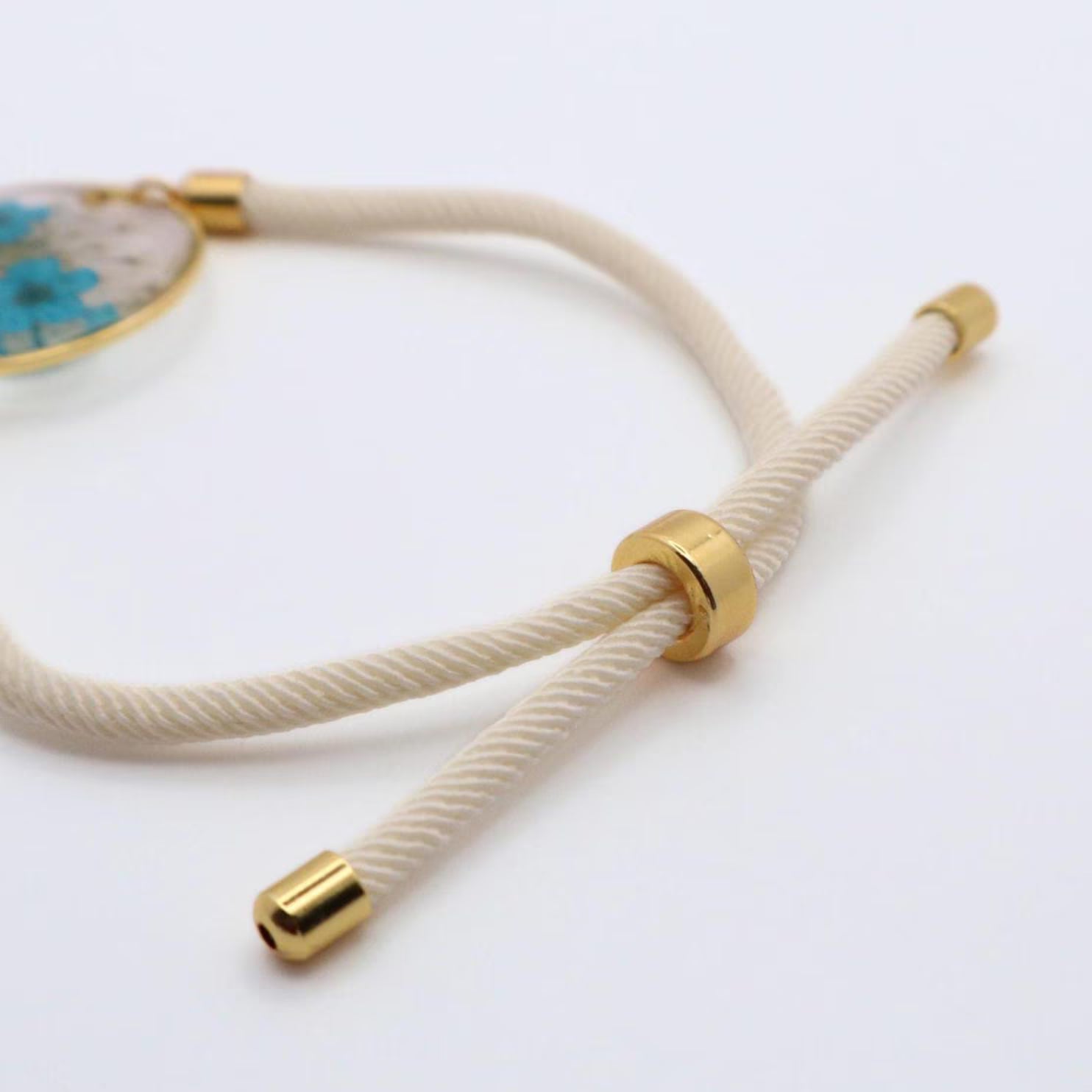 Real dried blue flower bracelet in clear resin with gold frame and white adjustable cord handmade jewelry
